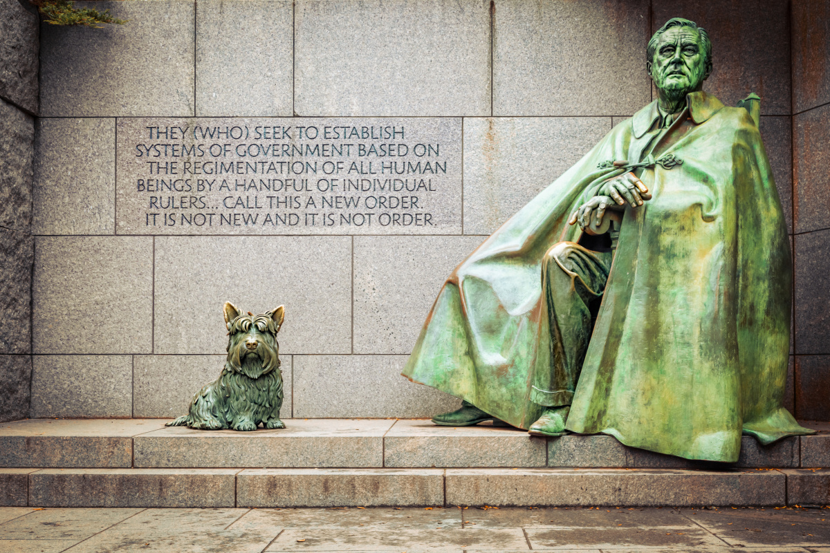bronze statue of FDR seated with Fala, his Scottish terrier, beside him