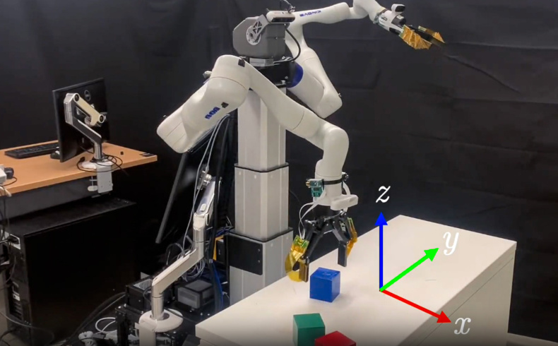 A robot arm manipulating blocks