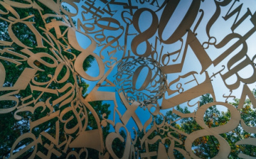 letters and symbols against a blue sky